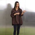 Cocoa brown oversized hoodie with silver floral embroidery and elastic cuffs by Timeless Boutique Kuwait