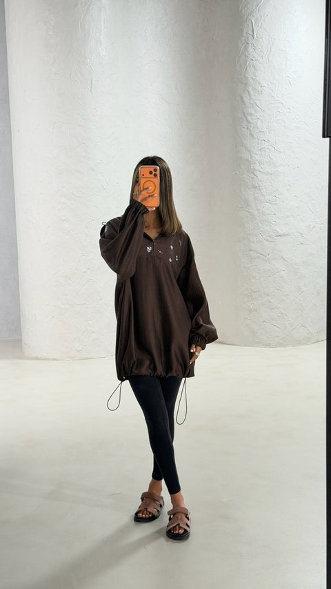 Cocoa brown oversized hoodie with silver floral embroidery and elastic cuffs by Timeless Boutique Kuwait