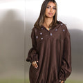 Cocoa brown oversized hoodie with silver floral embroidery and elastic cuffs by Timeless Boutique Kuwait